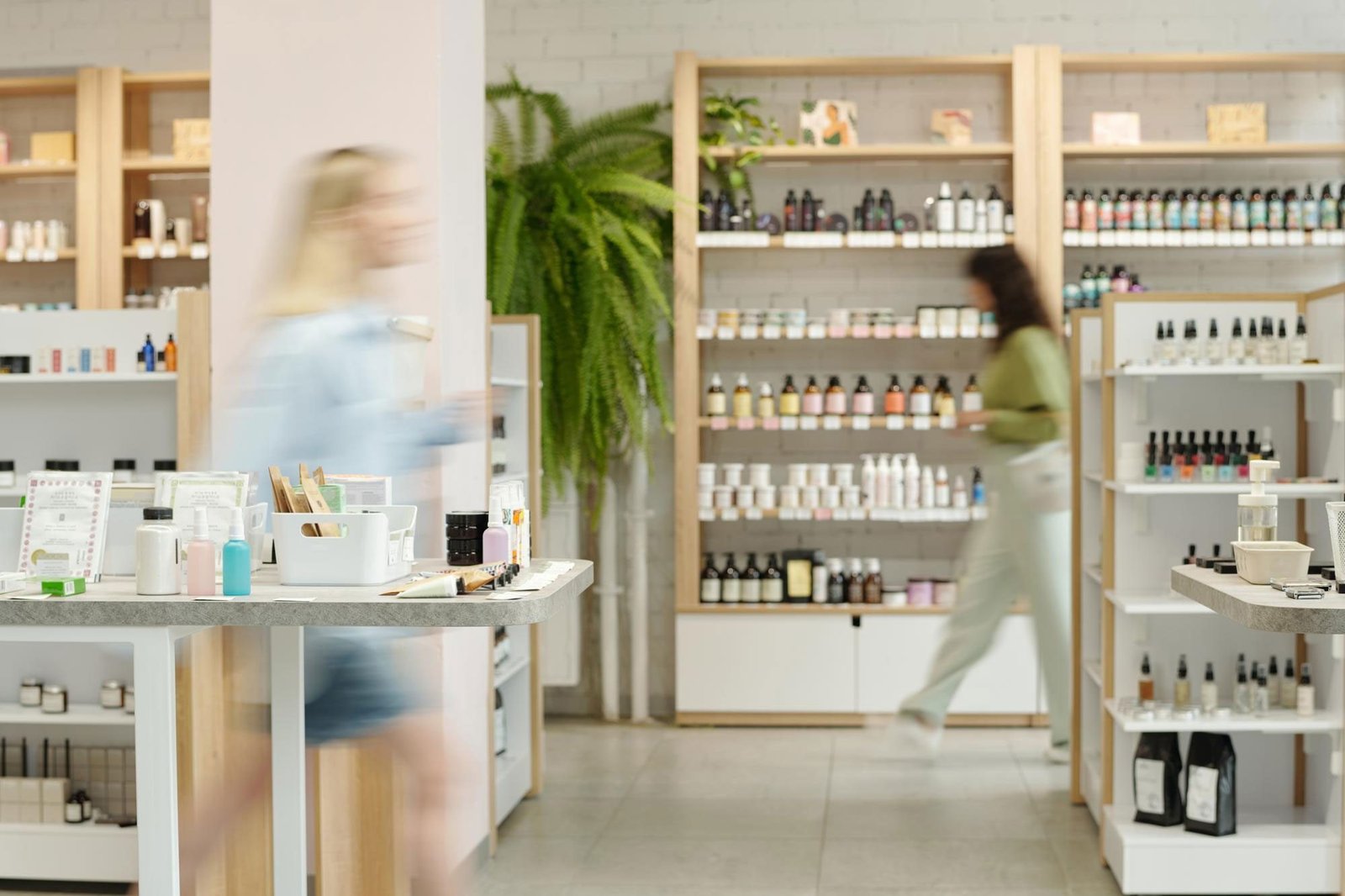 Customers browsing a modern beauty and personal care retail floor