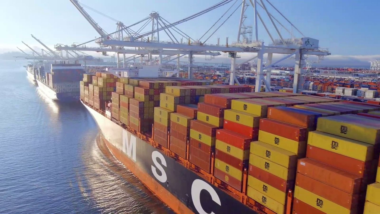 Aerial view of a container ship being loaded at a deep-sea port